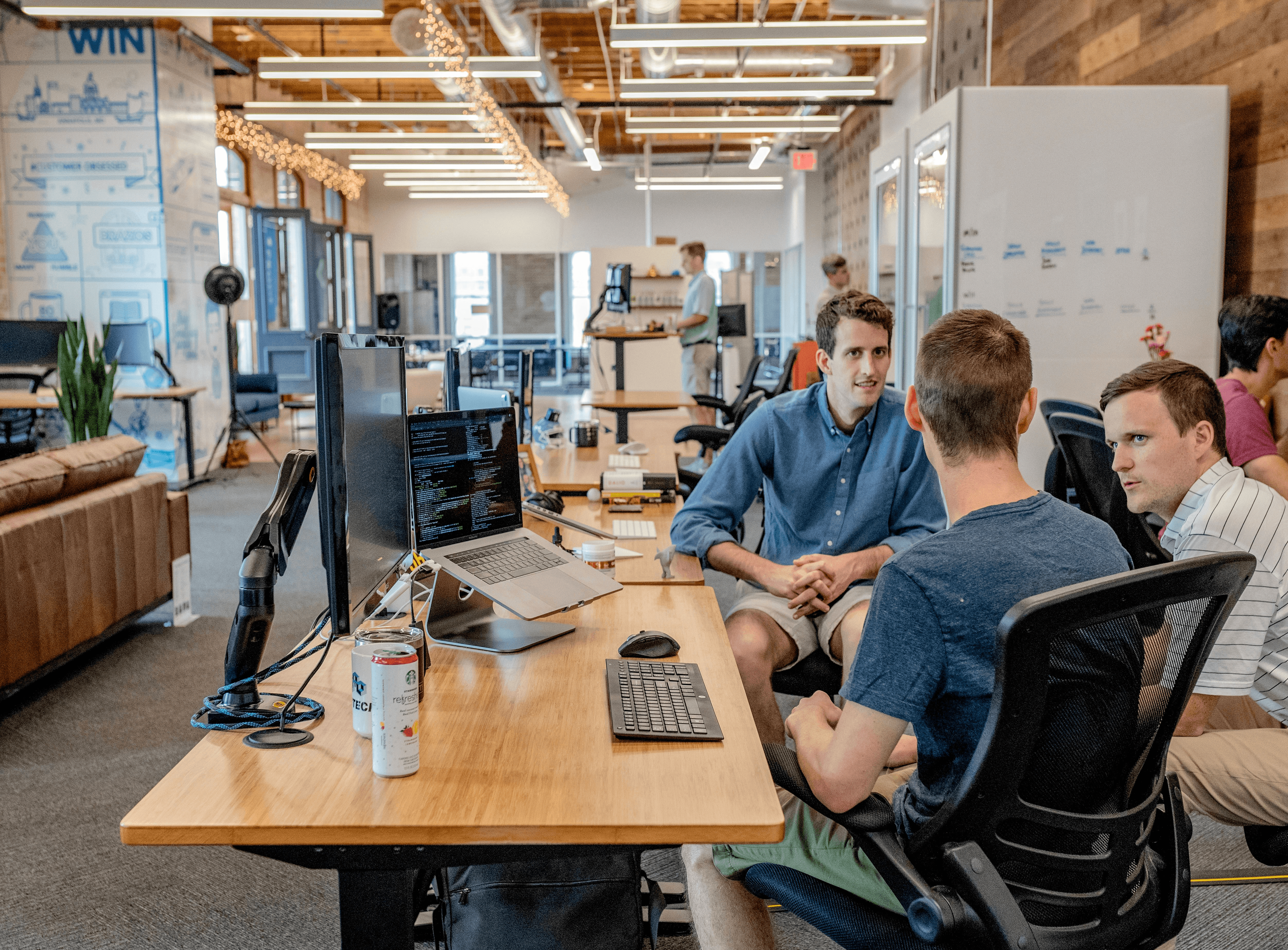 The studio team collaborating around a desk